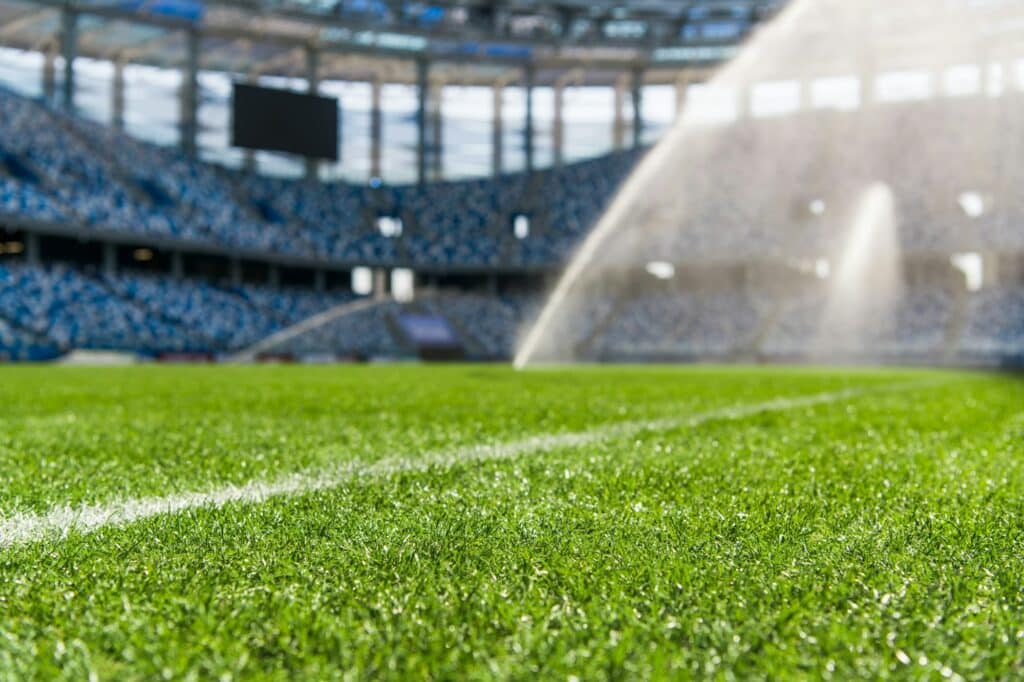 Dew on the artificial grass at empty stadium.